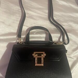 Elegant Black Handbag with Gold Accents